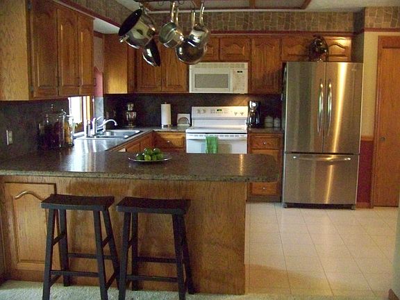Beautiful updated kitchen with new counters,sink, faucet and large pantry 