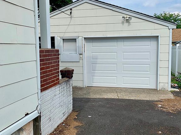 Driveway with parking for several cars.
