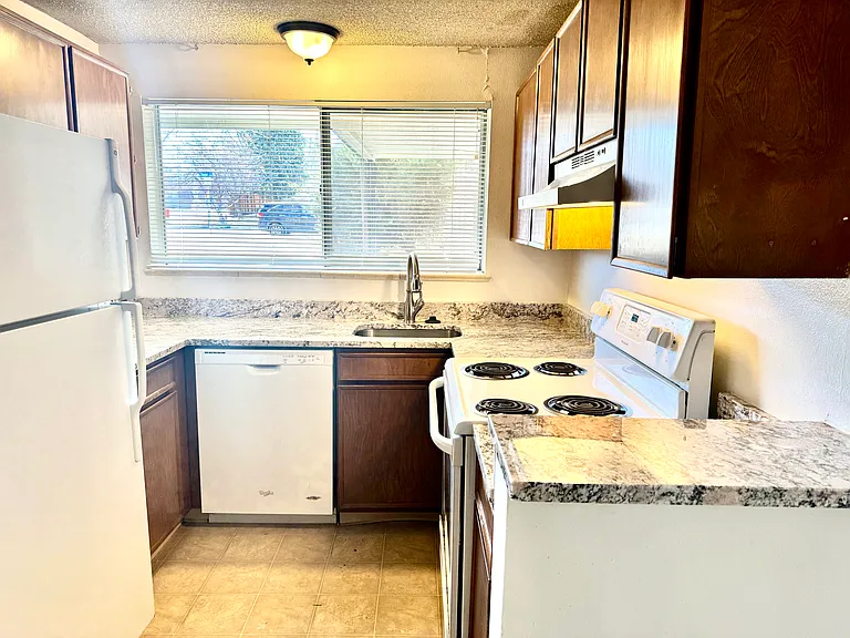 Up-graded kitchen with new granite counters, faucets etc.