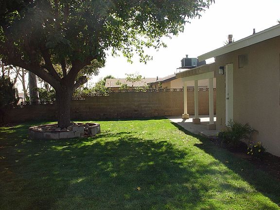 Large backyard with covered patio