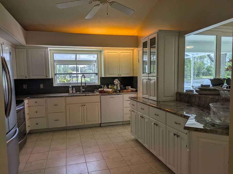 Kitchen overlooking lake, stainless steel appliances