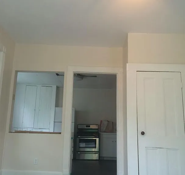 Living room, looking toward kitchen.