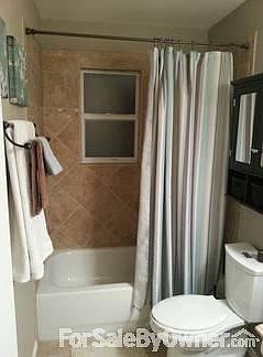 Kitchen
						:
						Marble tile countertop; glass tile back splash; new cabinets.