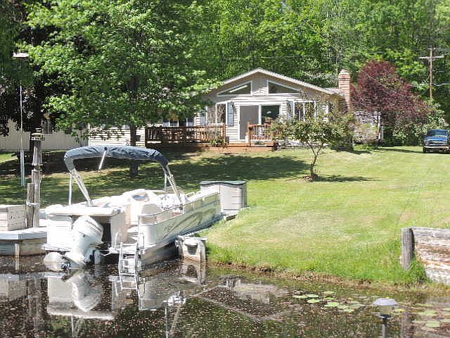 FROM CANAL
						:
						SHOWS BOAT SLIP AND FRONT OF HOUSE