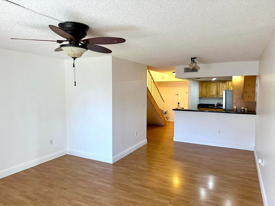 Living room looking into dining and kitchen