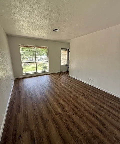 Living Room from Dining Room, when coming in front door, hallway is to the left and comes around to dining room.