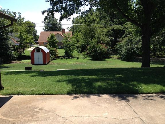 Beautiful extra large backyard with storage building