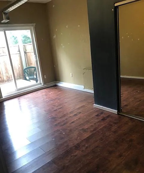 fifth bedroom with high ceiling also in basement daylight floor, with excess to back yard