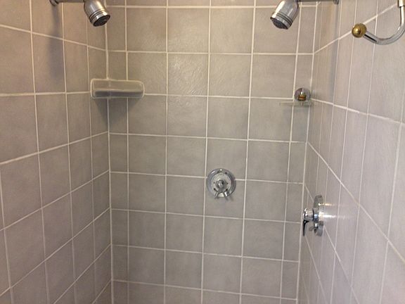 Double headed tile shower