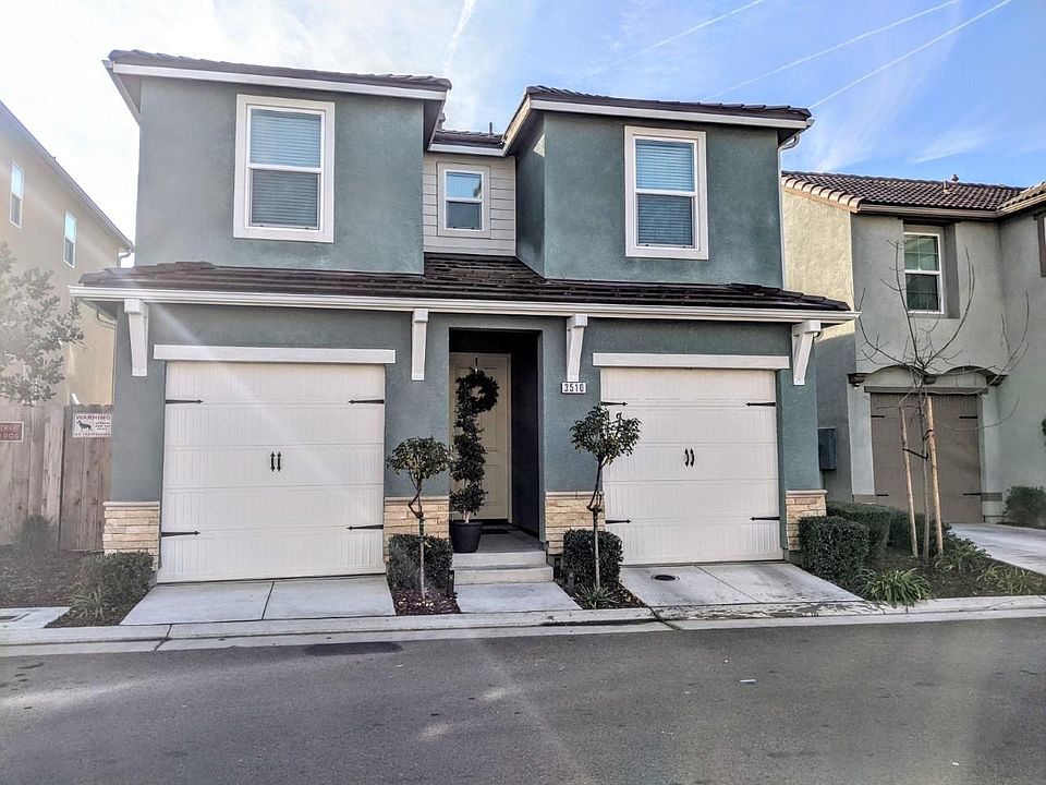 Beautiful cottage exterior with gray / blue color scheme.