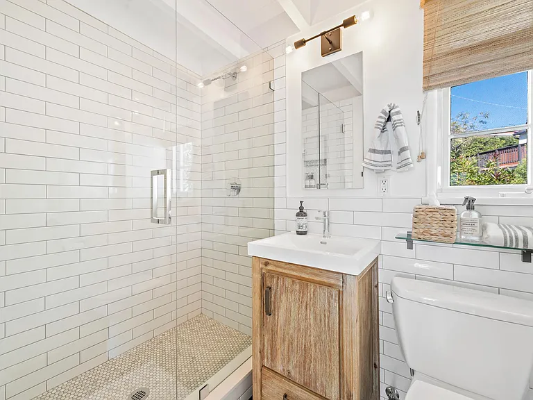 Walk in shower, medicine cabinet and vanity for storage, towel hooks, hair dryer