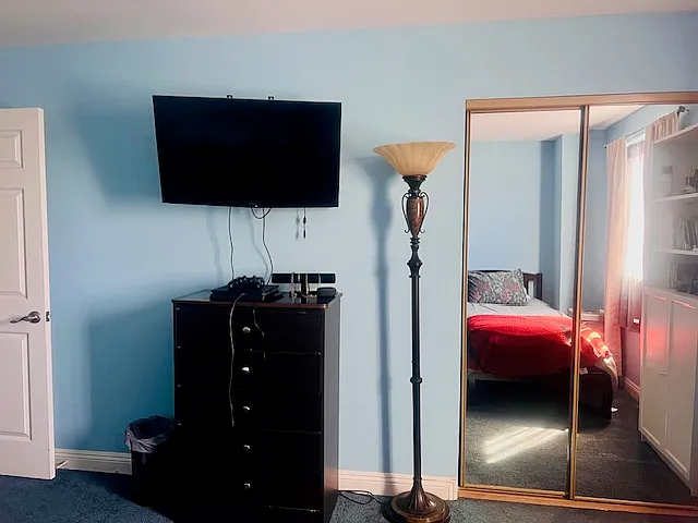 Bedroom #2: Twin beds, Ceiling fan, Flat screen TV w/ Fire-stick, Dresser, Table w/ 2 chairs, Bookshelf, Spacious closet, Black-out curtains.