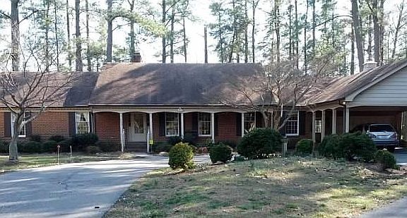 Front porch, double garage & double carport.