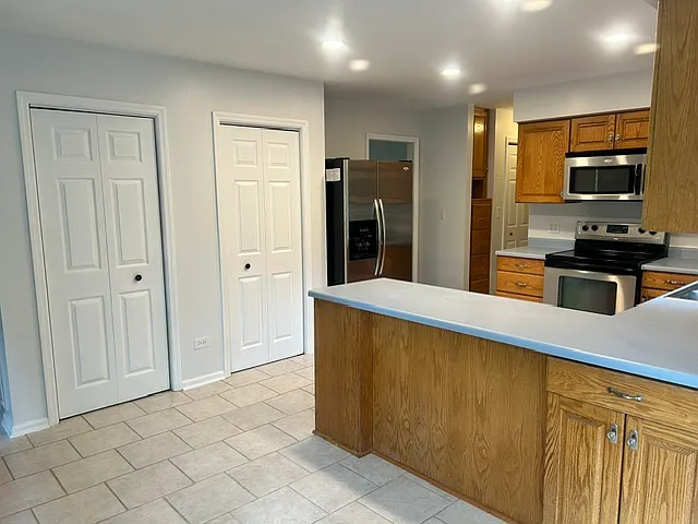 Expansive kitchen with more storage than you will know what to do with including 2 pantries, built in filing cabinet and 2 storage closets off the kitchen to laundry room and double car garage