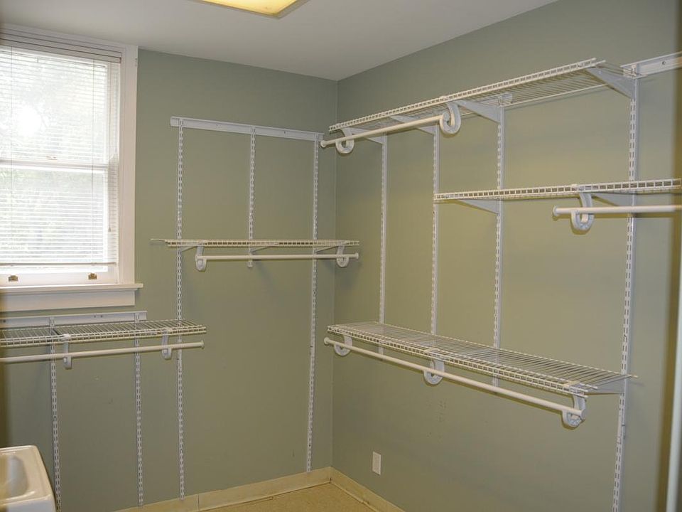 Walk in Closet 1 with sink and mirror