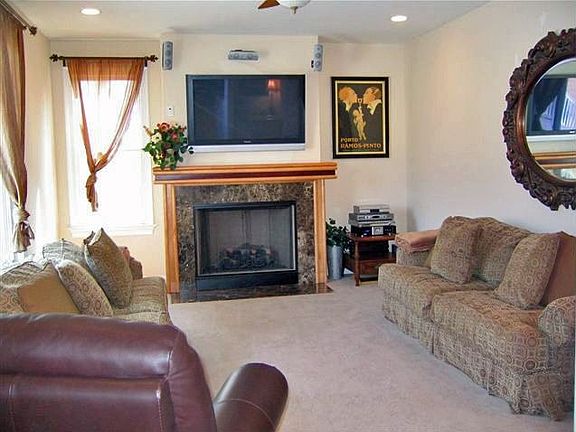 family room off kitchen with wet bar and gas fireplace