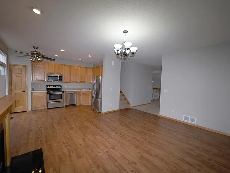 Large eat-in kitchen with fireplace and new flooring