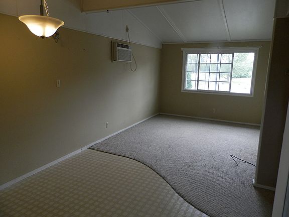Dining area in foreground and living room.