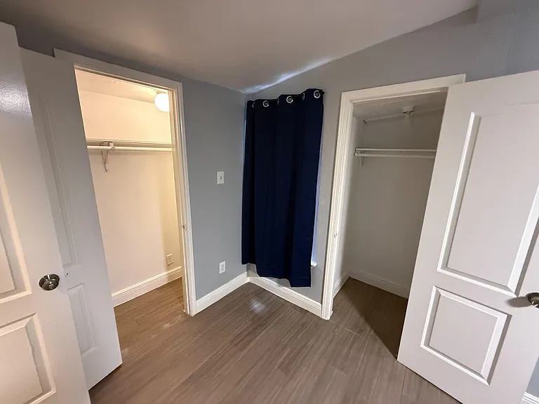 Bedroom area with two reach-in closets and easy-care flooring for convenient storage and everyday living.