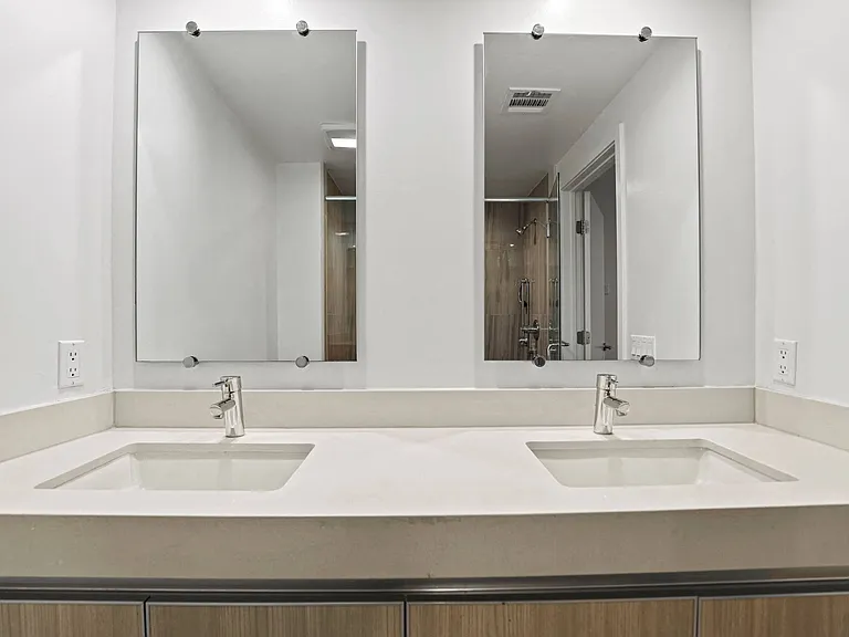 Bathroom with Double-Sink Vanity and Cabinet Storage