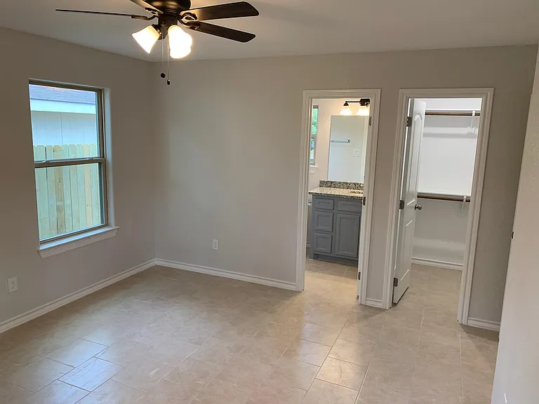 Master bedroom from corner, shows bath and closet