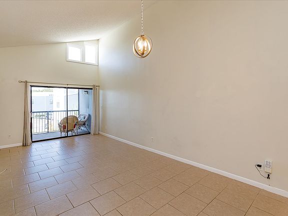 Living area with slider onto balcony