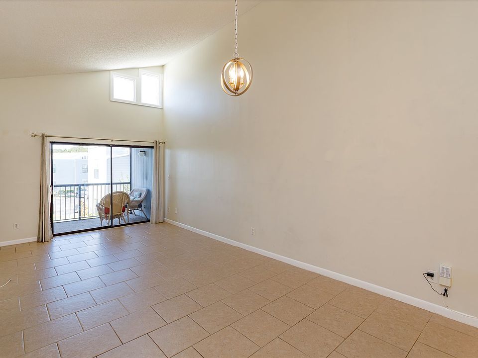 Living area with slider onto balcony