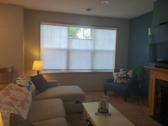 Custom blinds on all windows to allow natural light to come in. Blinds open from top and bottom