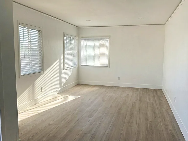 Full size living room with enough space to add small kitchen table.