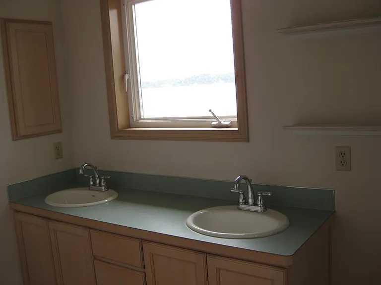Master bath with double sinks - view of Penn Cove.