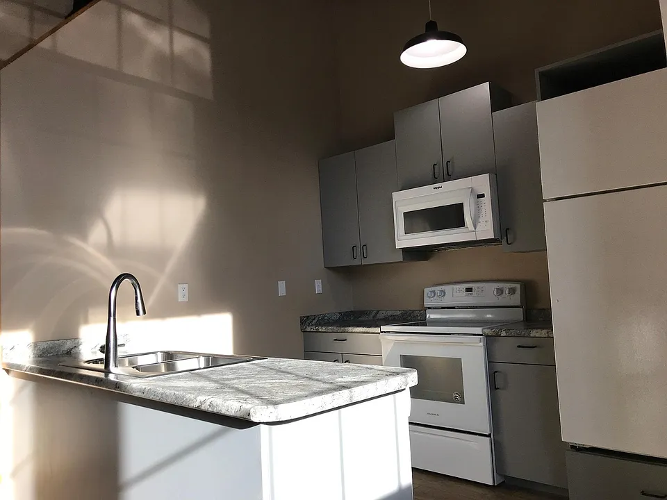 Updated Kitchen Including: New Flooring, Counter, Stove, Microwave, Sink/Faucet.