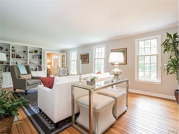 The living room also features built in shelves.