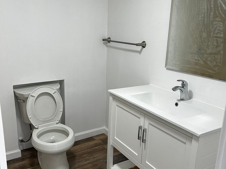 new toilet bowl and new sink with cabinet