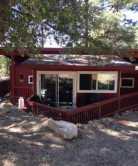 This is the unit from the back yard. This shows the sun room and the covered trailer.