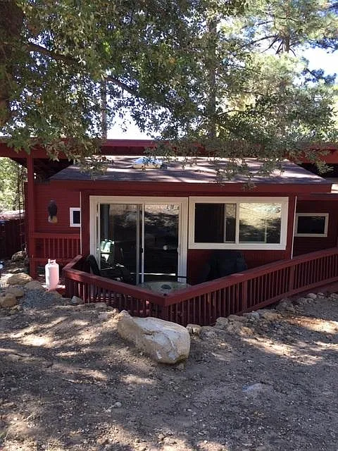 This is the unit from the back yard. This shows the sun room and the covered trailer.