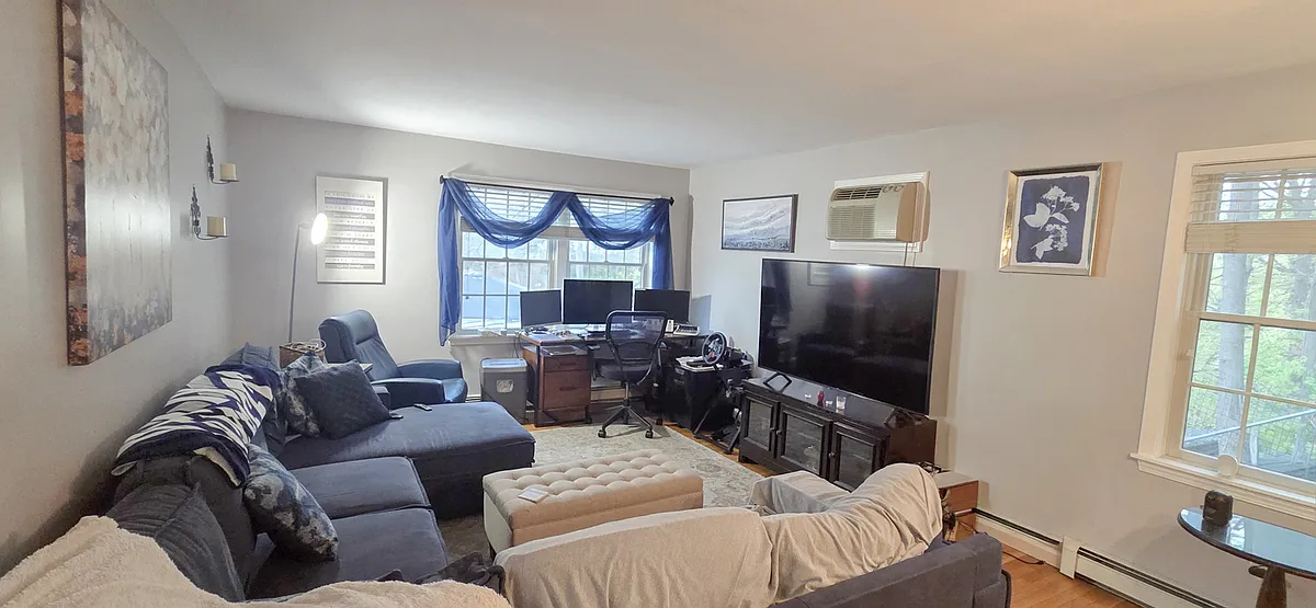 Large living room with hardwood floors - 36 Washington Pl E #2