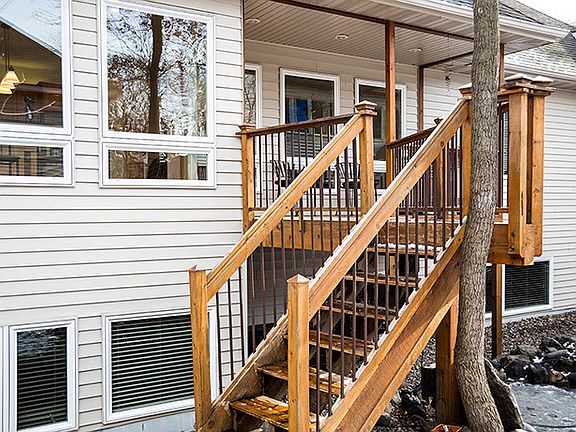 Cedar deck overlooks koi pond : Custom deck koi pond to enhance your enjoyment of feeding the fish f