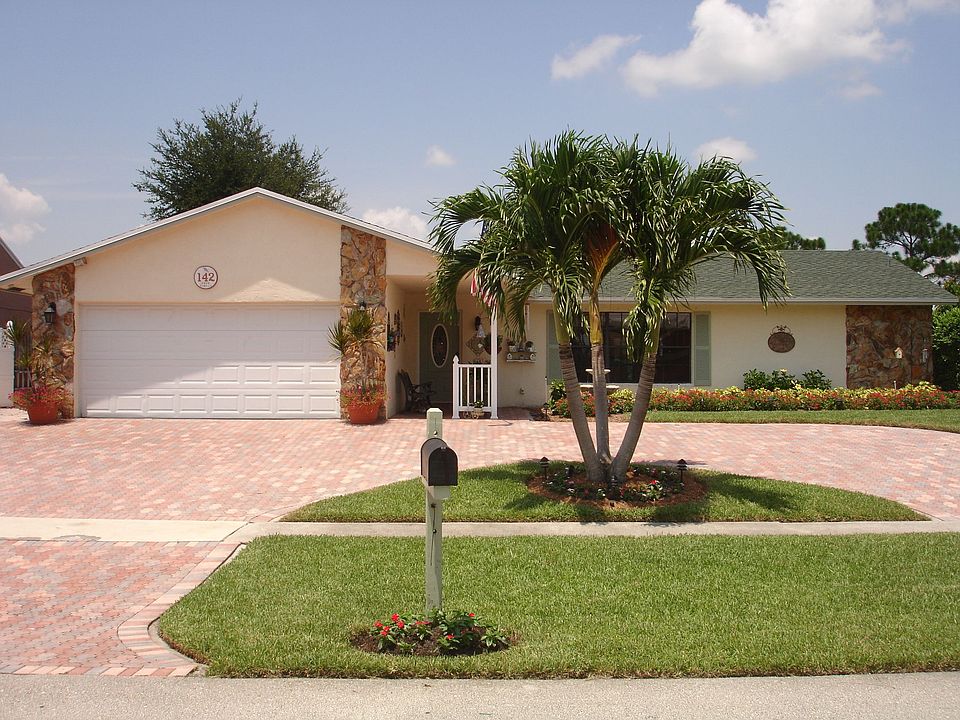 FRONT ELEVATION WITH LARGE PAVER STONE CIRCULAR DRIVEWAY