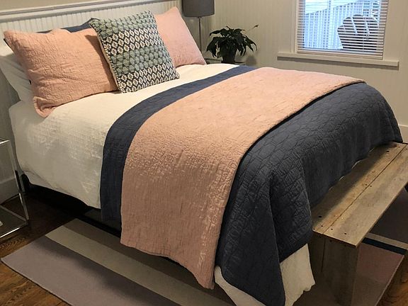 front bedroom has a double bed with all bed linens.