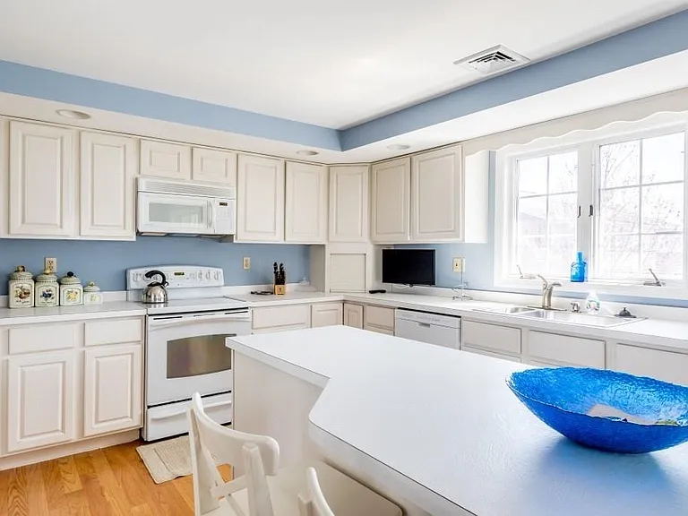 Oversized island kitchen with loads of cabinets and storage