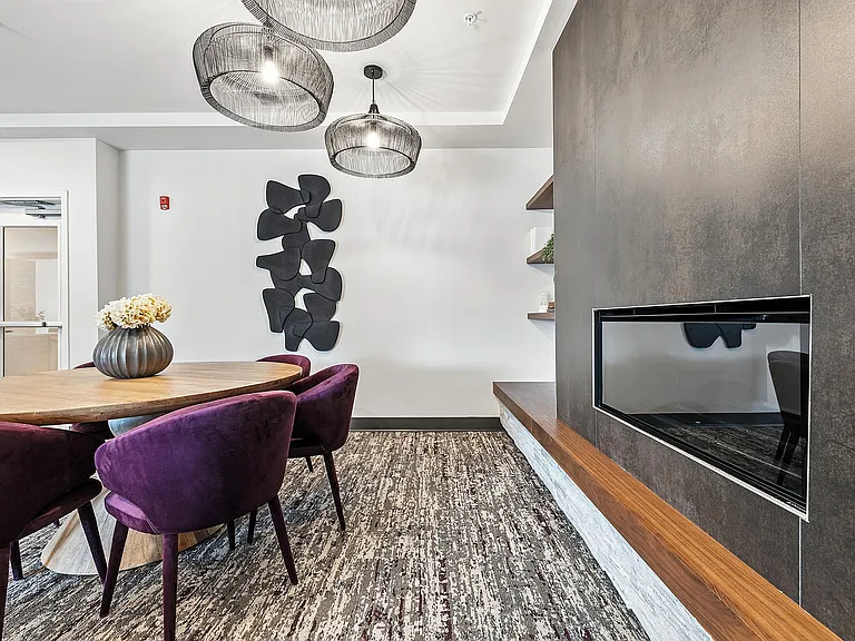Bright Community Living Area Featuring a Fireplace