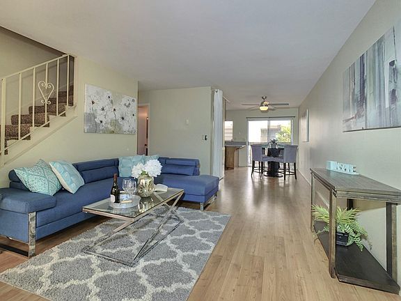 Open floor plan with easy-care Traffic Master laminate flooring downstairs tile in bathrooms and carpet upstairs.