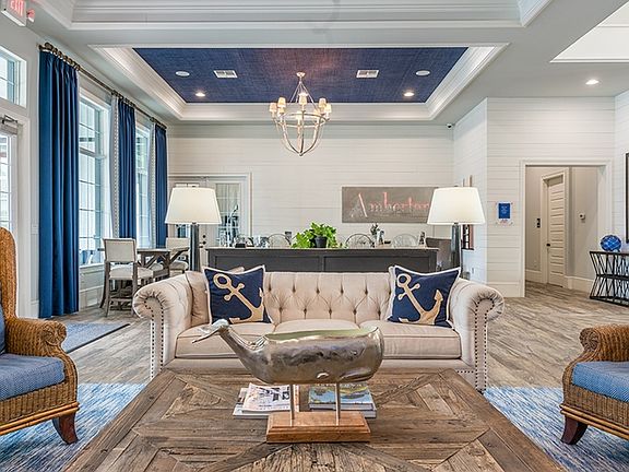 Clubhouse with a view of the pool and sun deck area