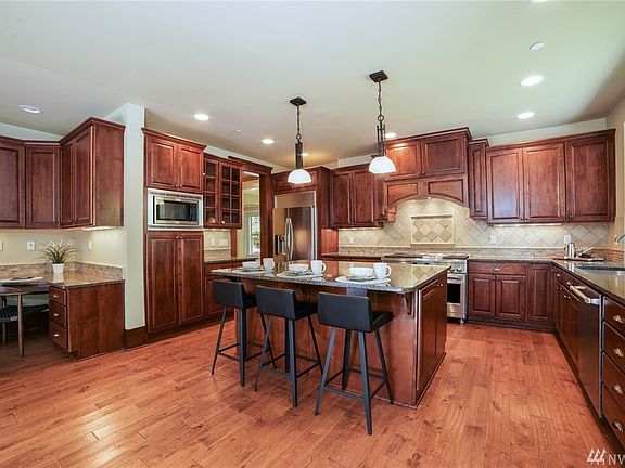 Chef's delight kitchen with professional appliances (including 48" gas range) and impressive center island.