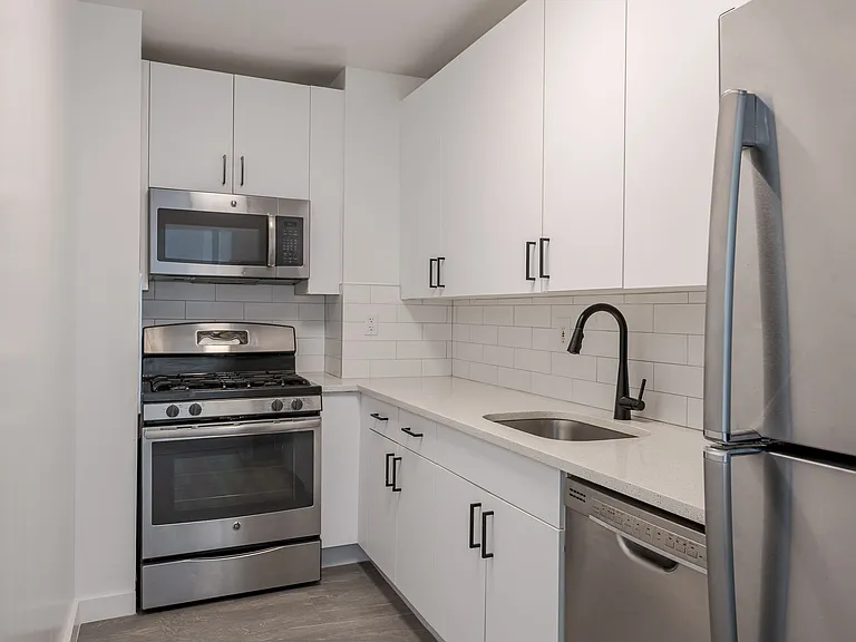 Sleek stainless steel appliances and modern cabinetry