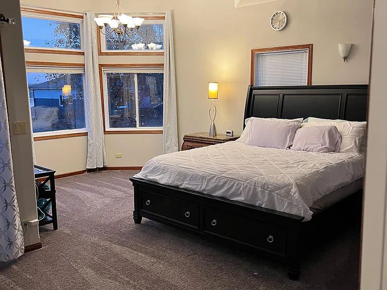 Master suite Bed and view of magnificent windows
