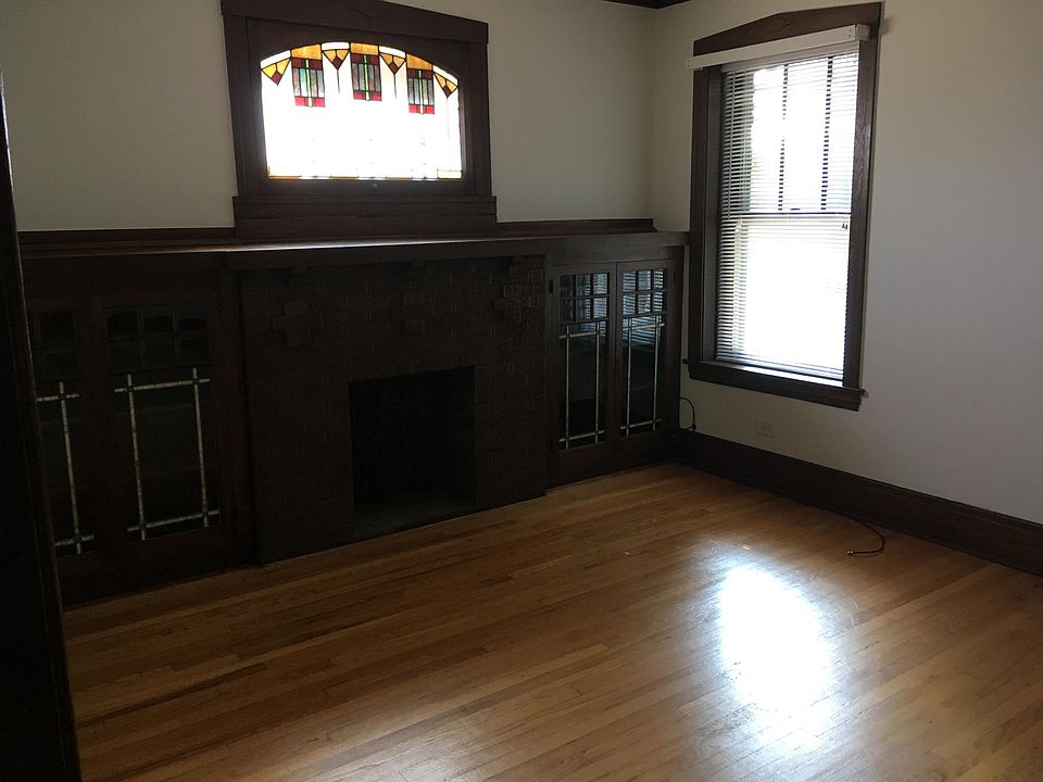 Living room with faux fire-place.