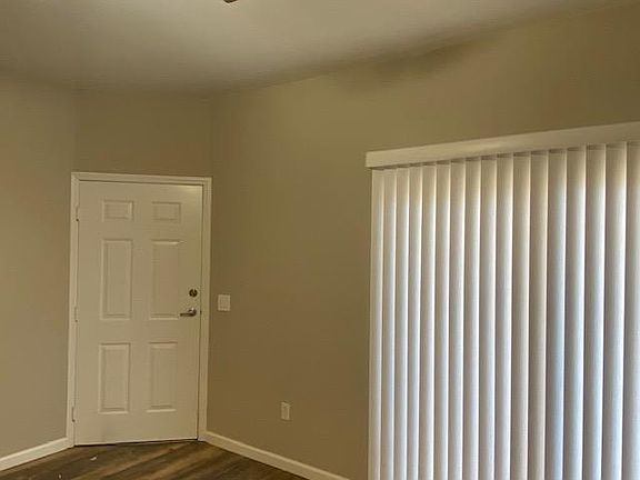 Large, Open Concept Living Room w/Slider open to Fenced Patio, easy Access to Parking, Club House, PO Box, Pool Area, Green spaces