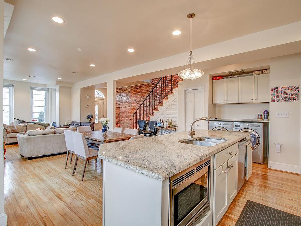 Open concept kitchen, dining room, and living room.
