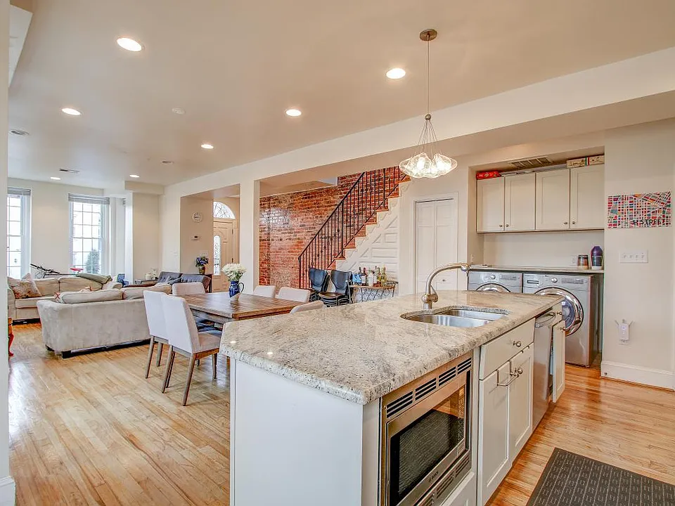 Open concept kitchen, dining room, and living room.